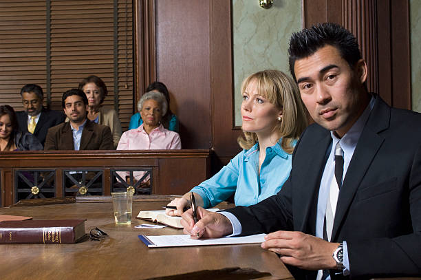 A consecutive interpreter taking notes during a court trial