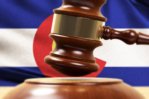 Gavel close-up in front of the Colorado flag symbolizing the justice system of the Colorado Court of Appeals