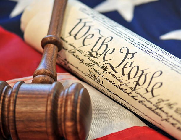 Gavel near U.S. Constitution highlighting legal interpreting services for justice
