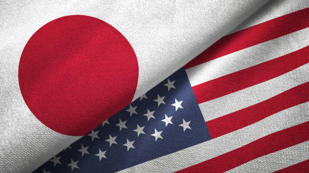 The flags of Japan and the United States intertwined symbolizing international dialoguejpg