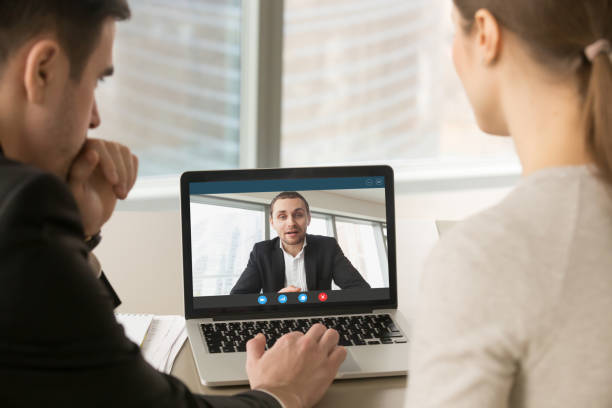 Three individuals in a video call with a virtual ASL interpreter for effective communicationjpg