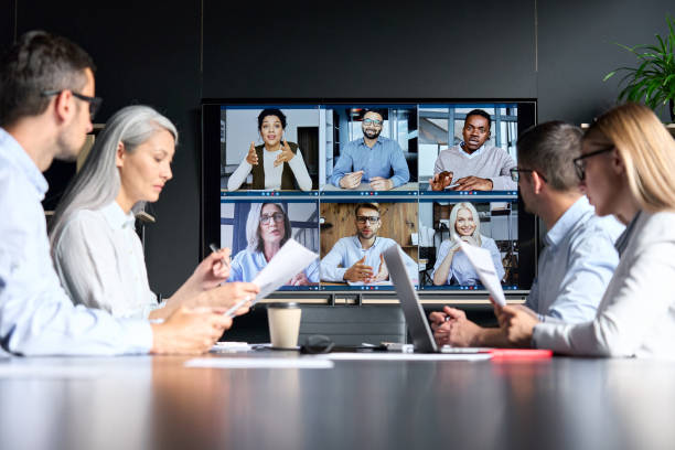 An interpreter helping in a business meeting via Video Remote Interpreting services
