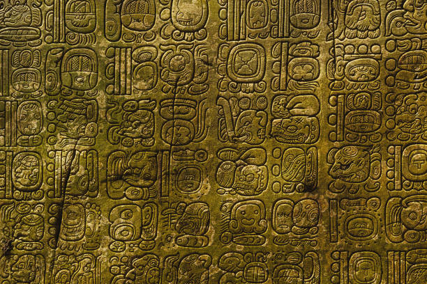 Image of ancient Mayan script with intricate glyph like charactersjpg