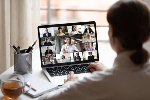 Interpreter assisting participants in a virtual meeting conferencejpg